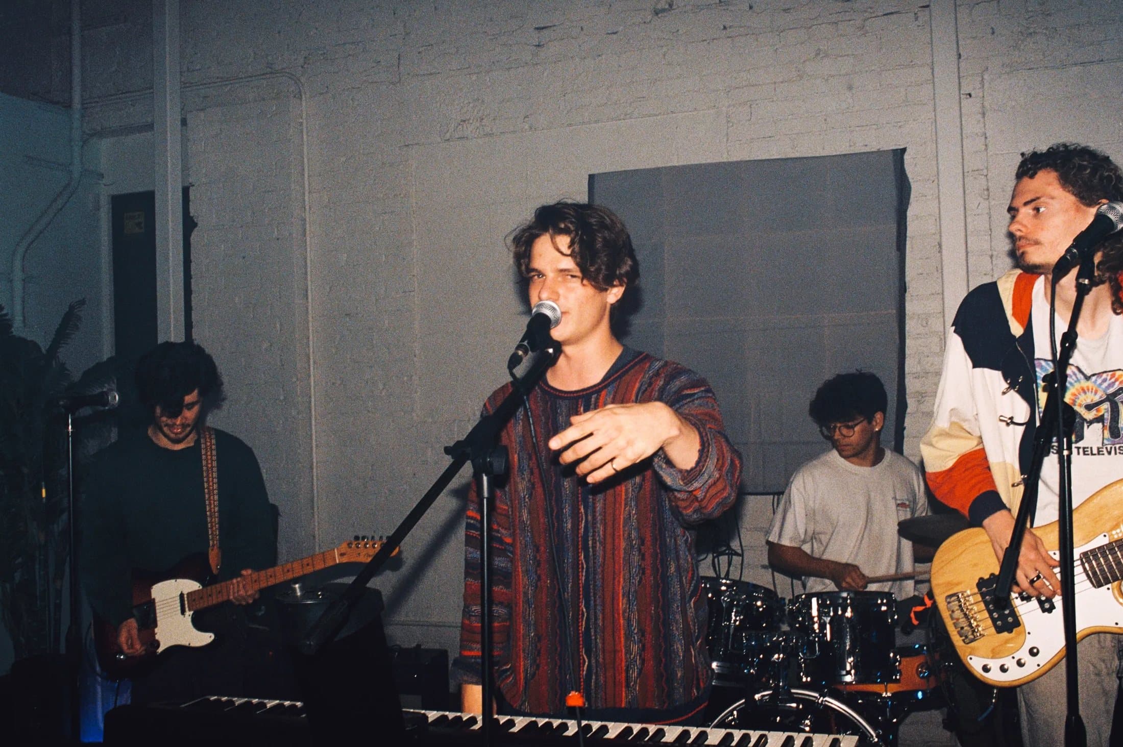 Michael singing with his band, live